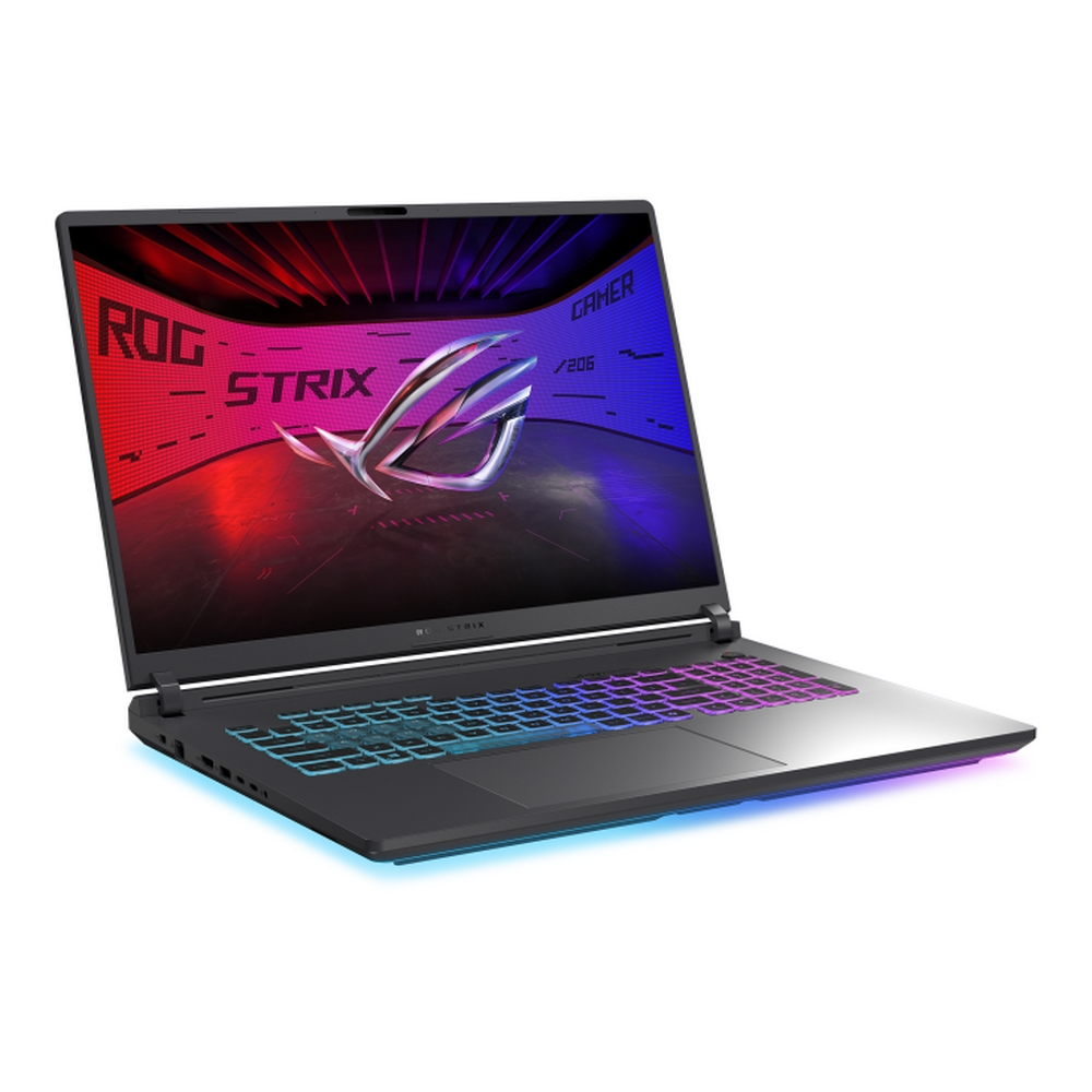 Un laptop ROG Strix nero è aperto su una superficie bianca. Lo schermo mostra un logo e luci colorate. La tastiera ha tasti colorati.