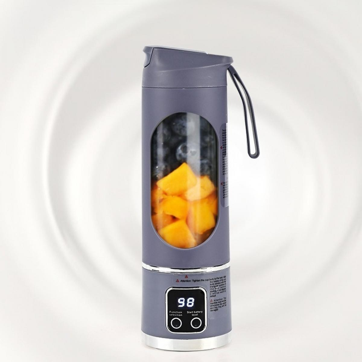Ein grauer Mixer mit Früchten im Inneren. Er enthält Mango und Blaubeeren. Er hat eine Digitalanzeige mit der Anzeige '98'.