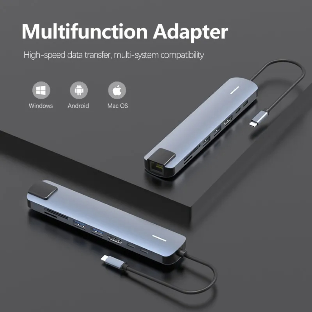 Zwei graue Multifunktionsadapter mit mehreren Anschlüssen, Kabeln und einem weißen Streifen. Text: Multifunktionsadapter, Windows, Android, Mac OS.