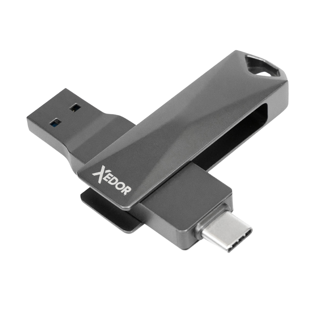 Szara pamięć flash USB XEDOR. Posiada złącze USB-A i USB-C. Dysk znajduje się na białym tle.