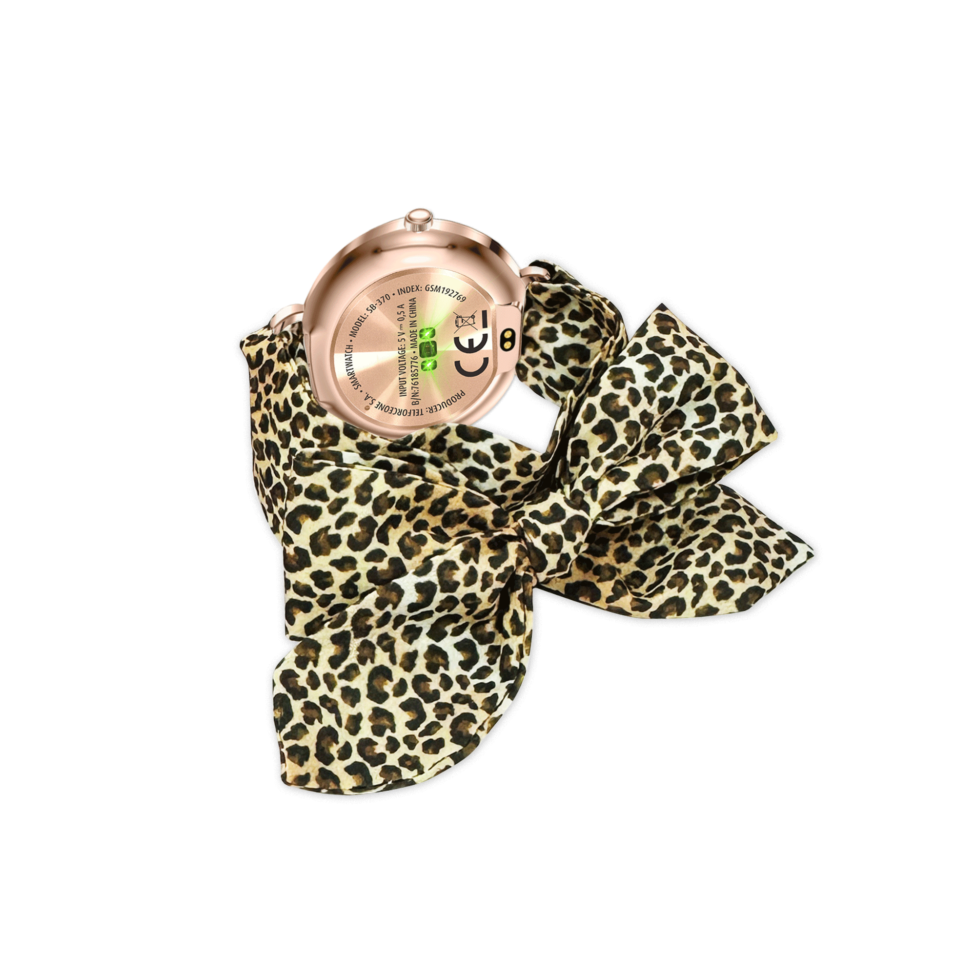 Zegarek smartwatch w kolorze różowego złota jest przymocowany do szalika z nadrukiem w cętki z kokardą. Tło jest białe.