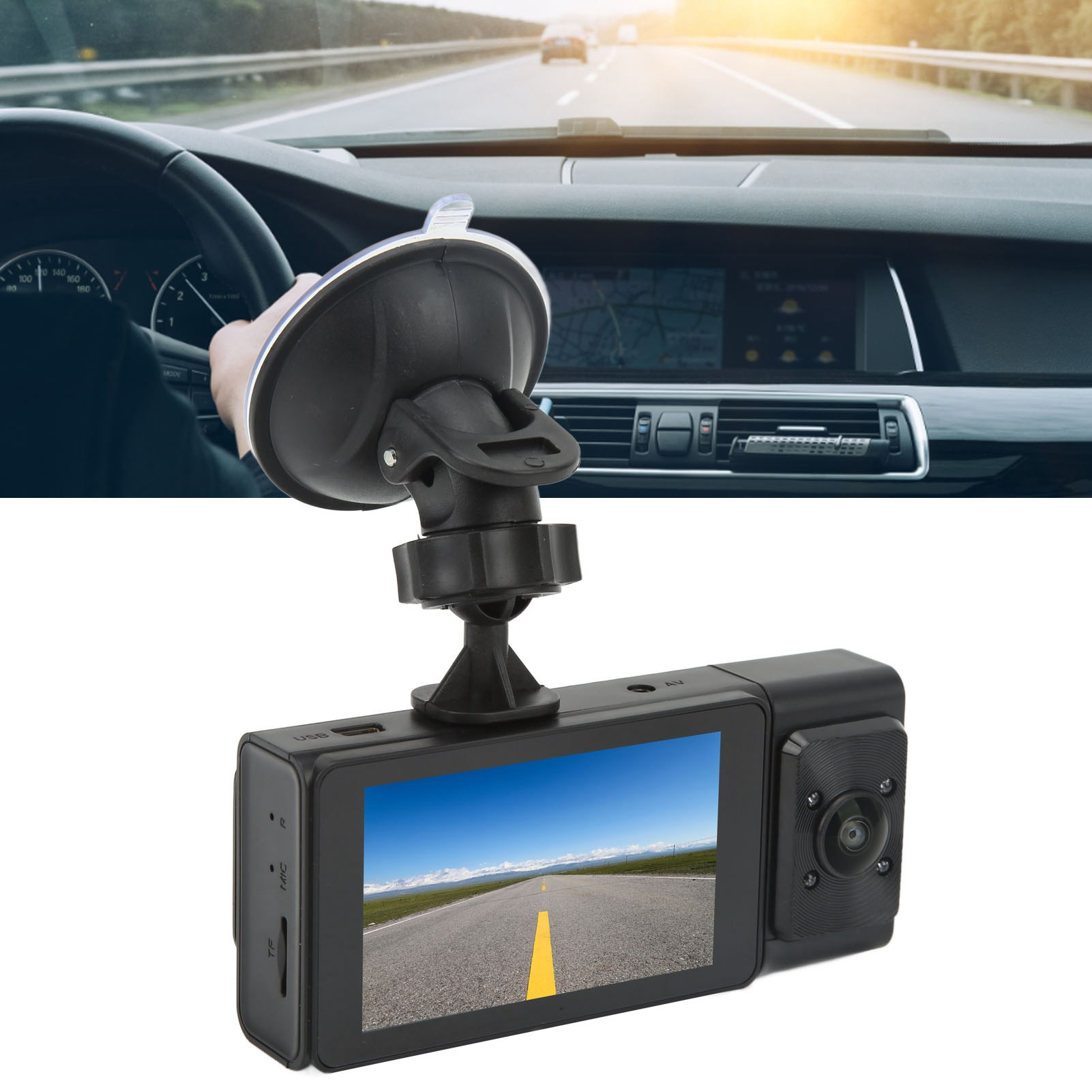 Eine am Fenster montierte Dashcam, die eine Straße zeigt. Die Hand des Fahrers ist am Lenkrad.