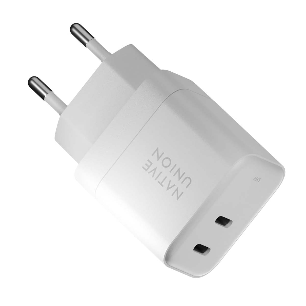 Un caricatore bianco Native Union da 25W con due spine. Ha due porte USB e il logo Native Union.