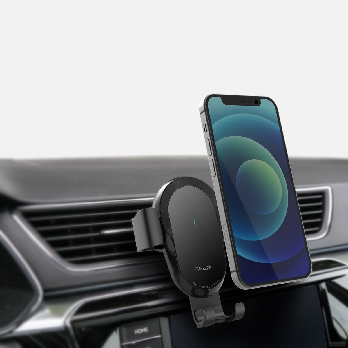 A smartphone is mounted on a car's dashboard. The phone displays a blue and green wallpaper. A black wireless charger holds the phone.