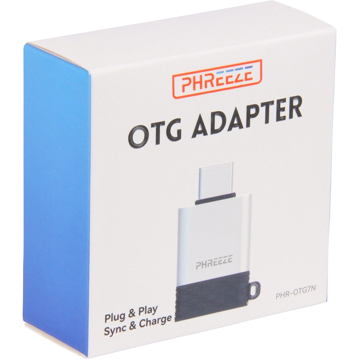 Witte doos met blauwe zijkant. Tekst 'OTG ADAPTER' en 'PHREEZE' logo. Afbeelding van een zilveren adapter. Tekst 'Plug & Play Sync & Charge'.
