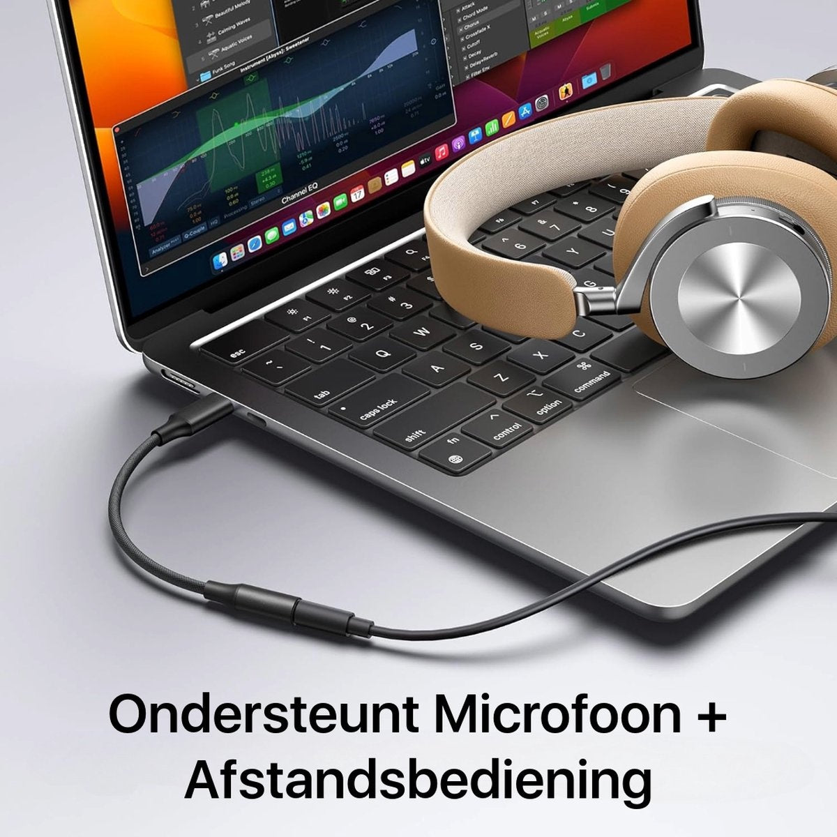 Laptop with headphones on the keyboard, connected by a cable. A software interface is open on the screen.