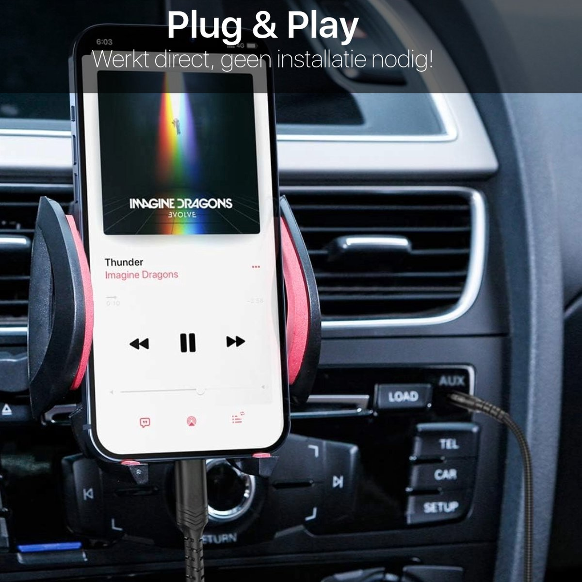A phone in a car holder displays music. A charging cable is connected. Buttons and a car dashboard are visible in the background.