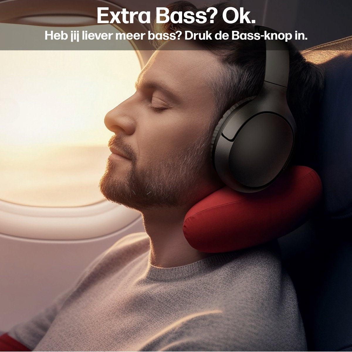 A man wearing headphones and a neck pillow on a plane, eyes closed. Text says 'Extra Bass? Ok.'.