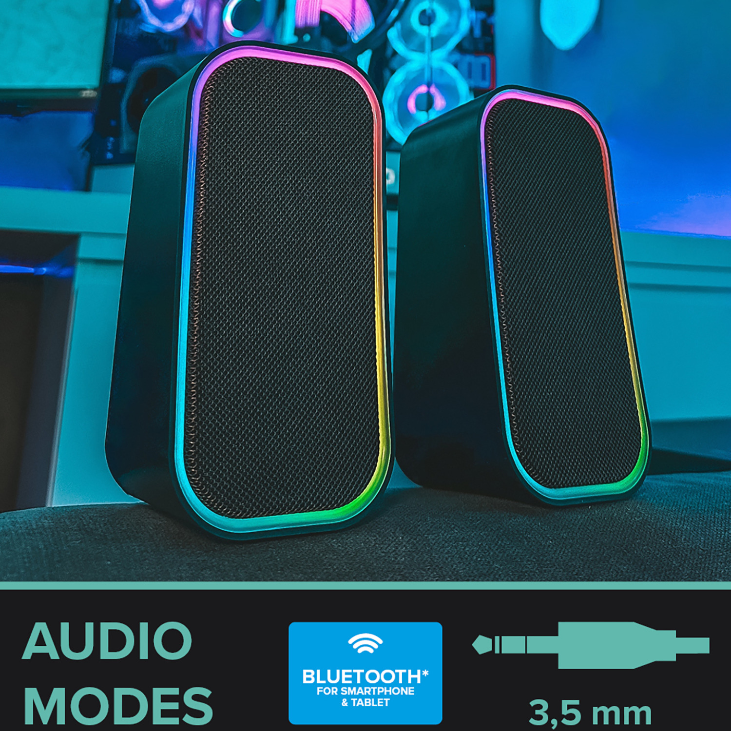 Due altoparlanti neri con bordi a LED arcobaleno. Sotto sono presenti le icone della modalità audio e un jack da 3,5 mm. Visibile anche il logo Bluetooth.