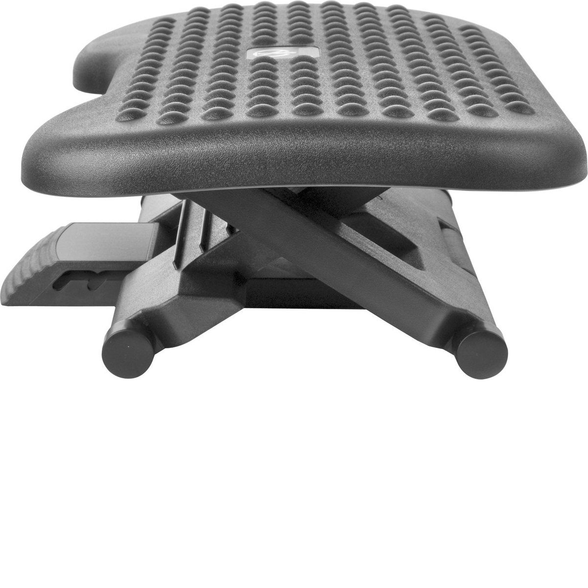 A black footrest, featuring an adjustable height. It has a textured surface and is set against a white background. The design appears ergonomic.