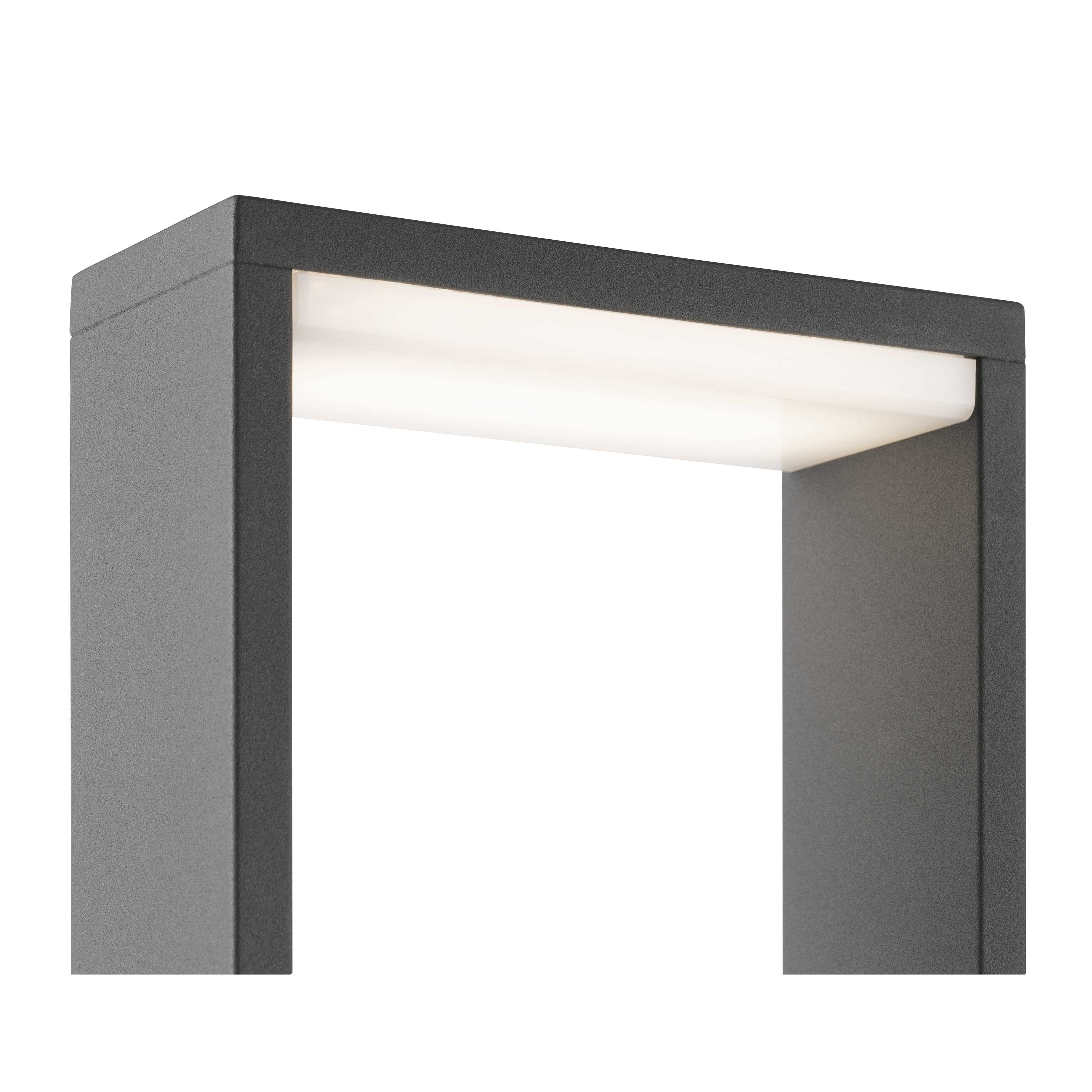Un apparecchio di illuminazione rettangolare grigio scuro. Ha un pannello luminoso bianco brillante.