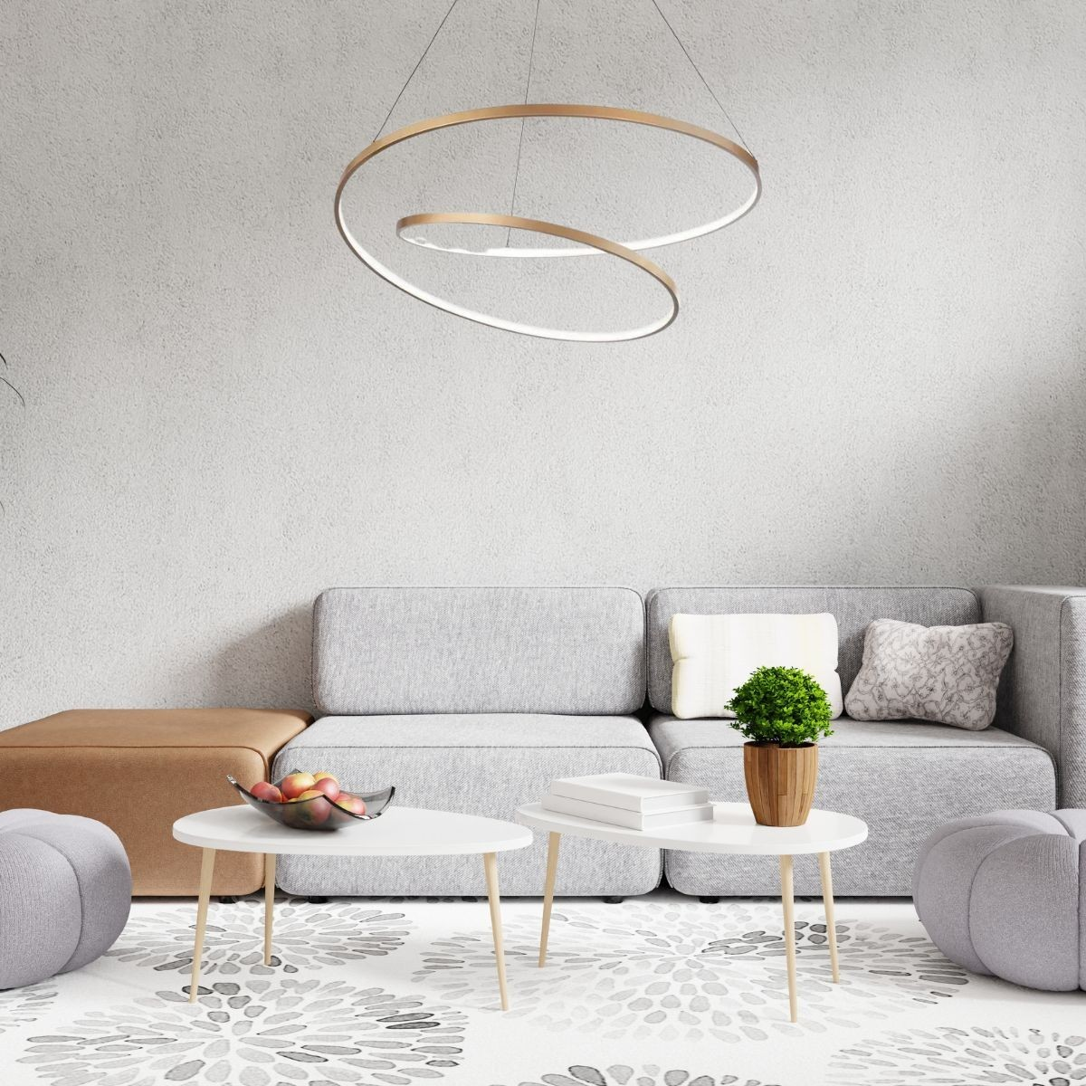 Un soggiorno moderno con divano grigio, due tavolini bianchi e lampada decorativa. Una fruttiera su un tavolo.