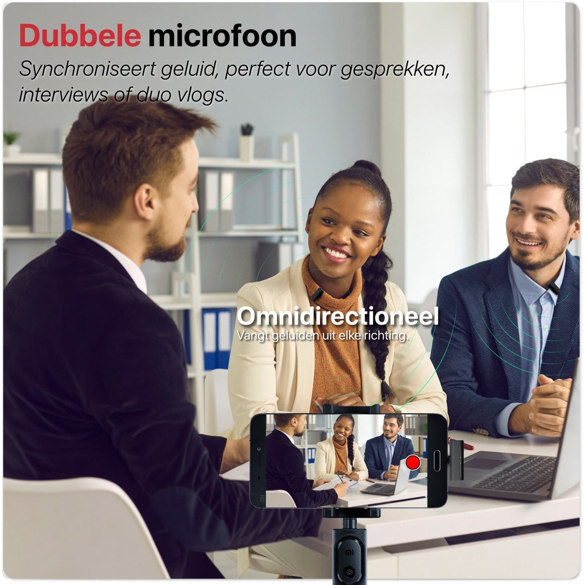 Three people in a business meeting, one recording on a phone. The phone is mounted on a tripod. They are smiling.