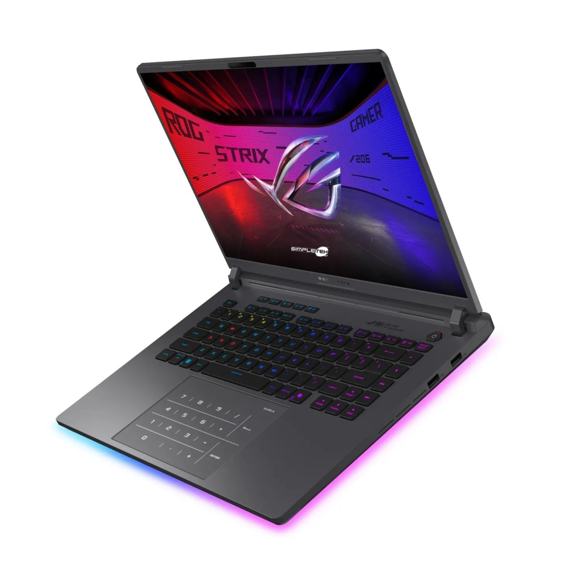 Un laptop nero, modello ROG Strix, è aperto. Lo schermo mostra una grafica colorata. La tastiera è illuminata con luci arcobaleno.