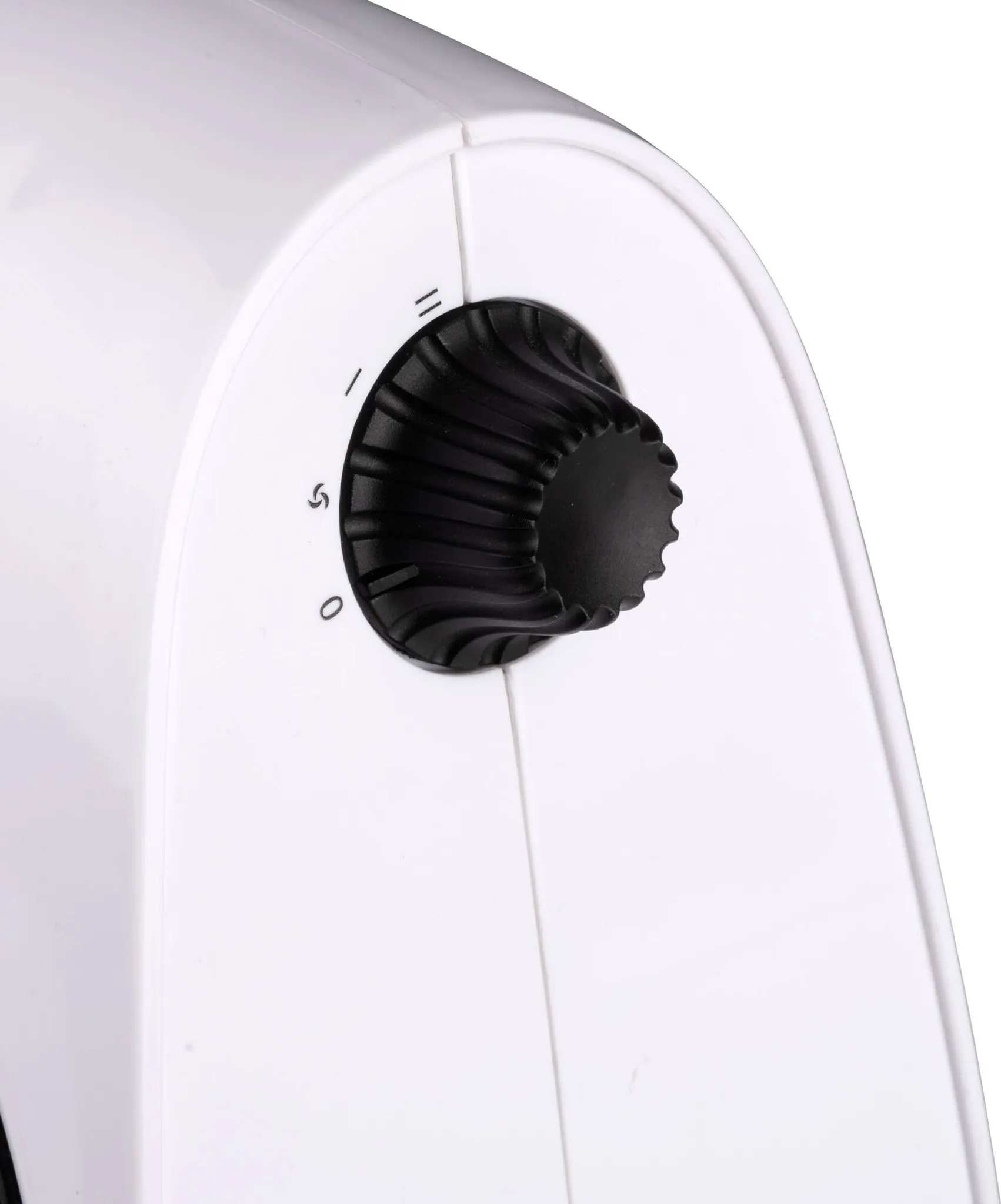 Close-up of a white appliance with a black rotary dial. Numbers 0, 1, and 5 are visible on the dial.