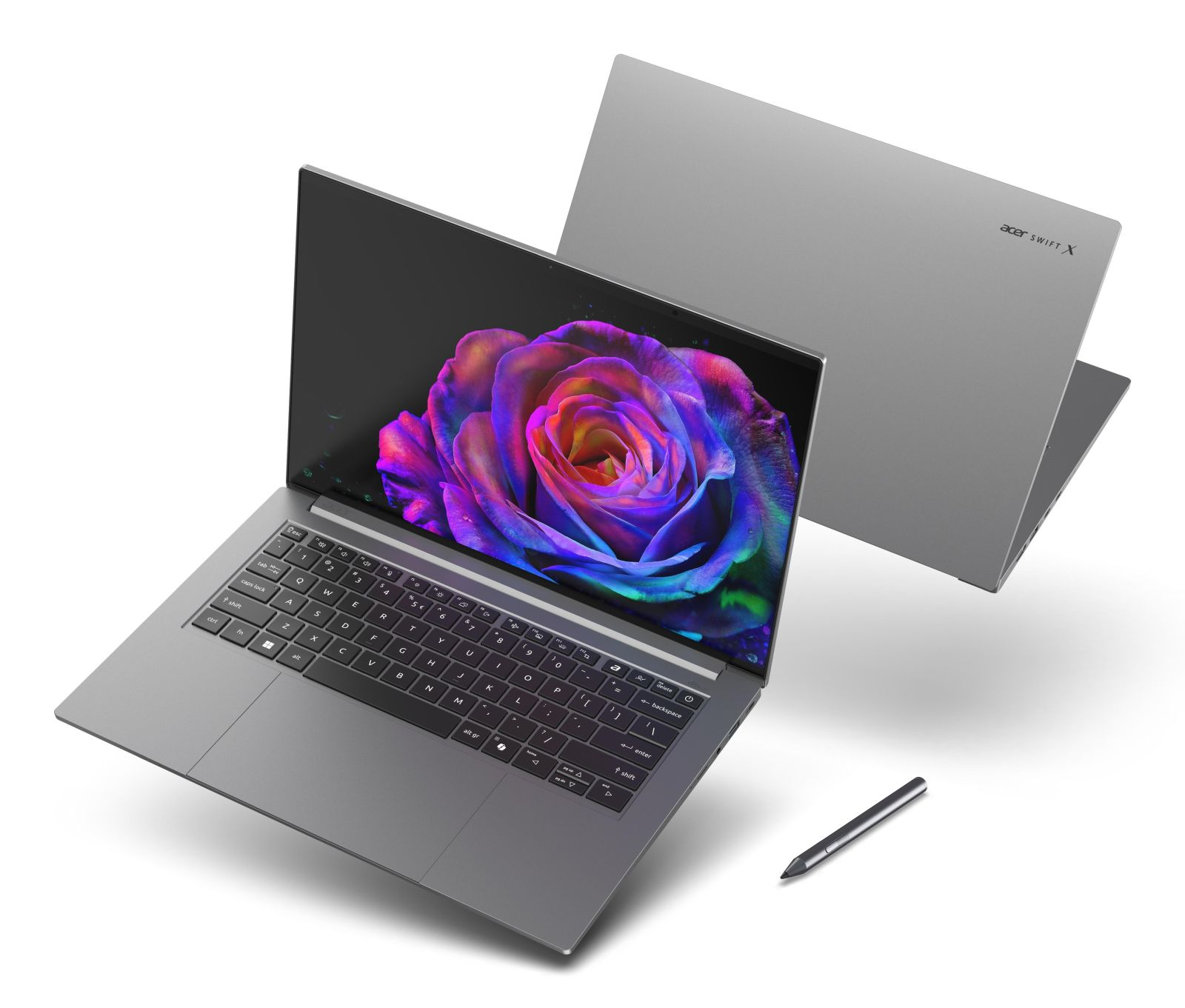 Szary laptop Acer Swift X z kolorową różą na ekranie, rysikiem i drugim laptopem w tle.