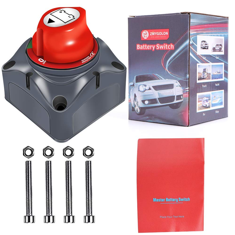 Ein roter Batterieschalter, eine Box und ein Handbuch. Der Schalter hat einen roten Knopf. Box sagt 'Battery Switch'. Das Handbuch ist rot.