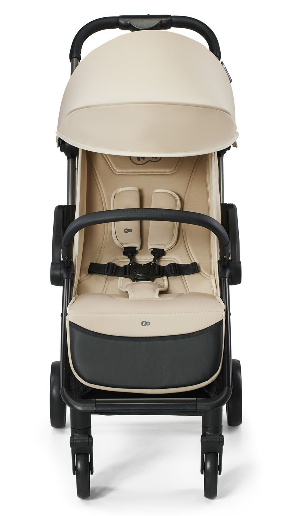 Ein beiger und schwarzer Kinderwagen. Er hat ein Verdeck, einen gepolsterten Sitz und einen schwarzen Rahmen. Die Räder sind schwarz.