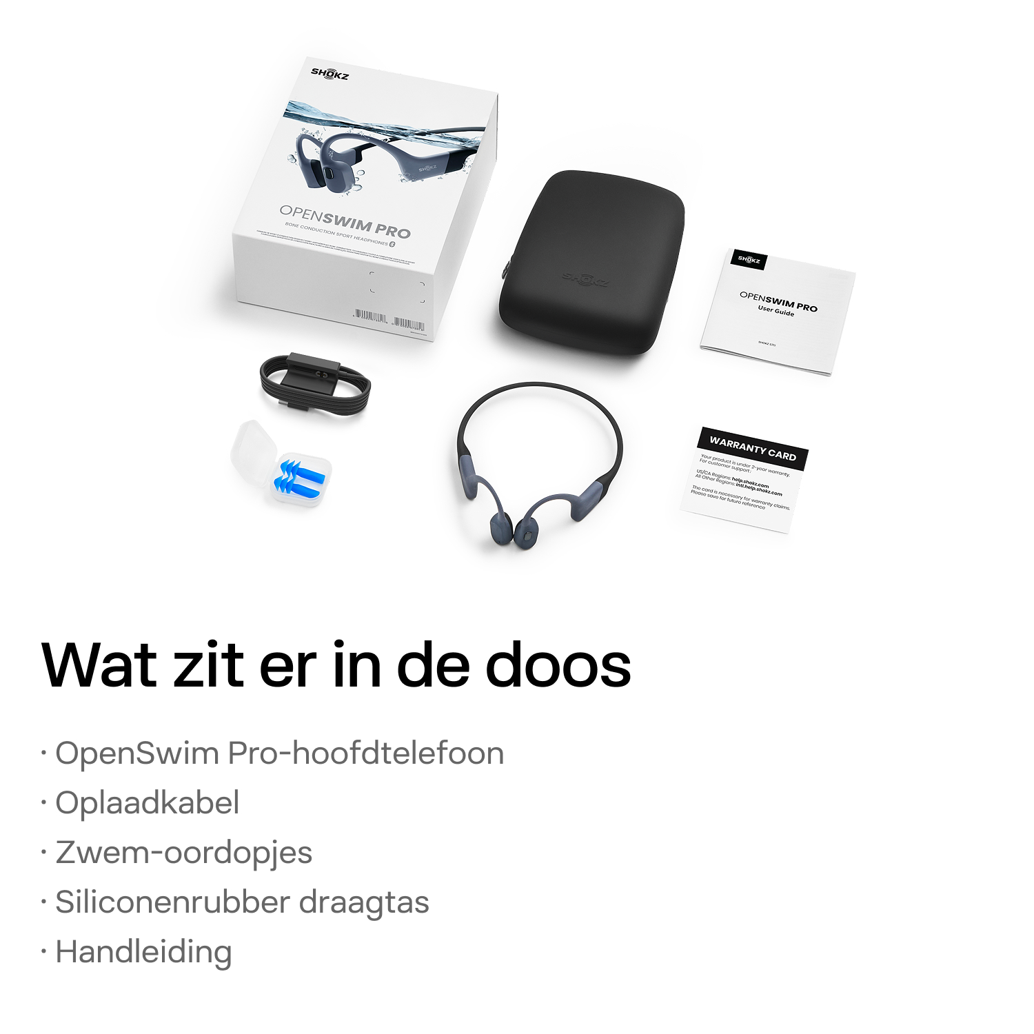 OpenSwim Pro koptelefoon, oplader, oordopjes, siliconen hoes en handleiding op een wit oppervlak.
