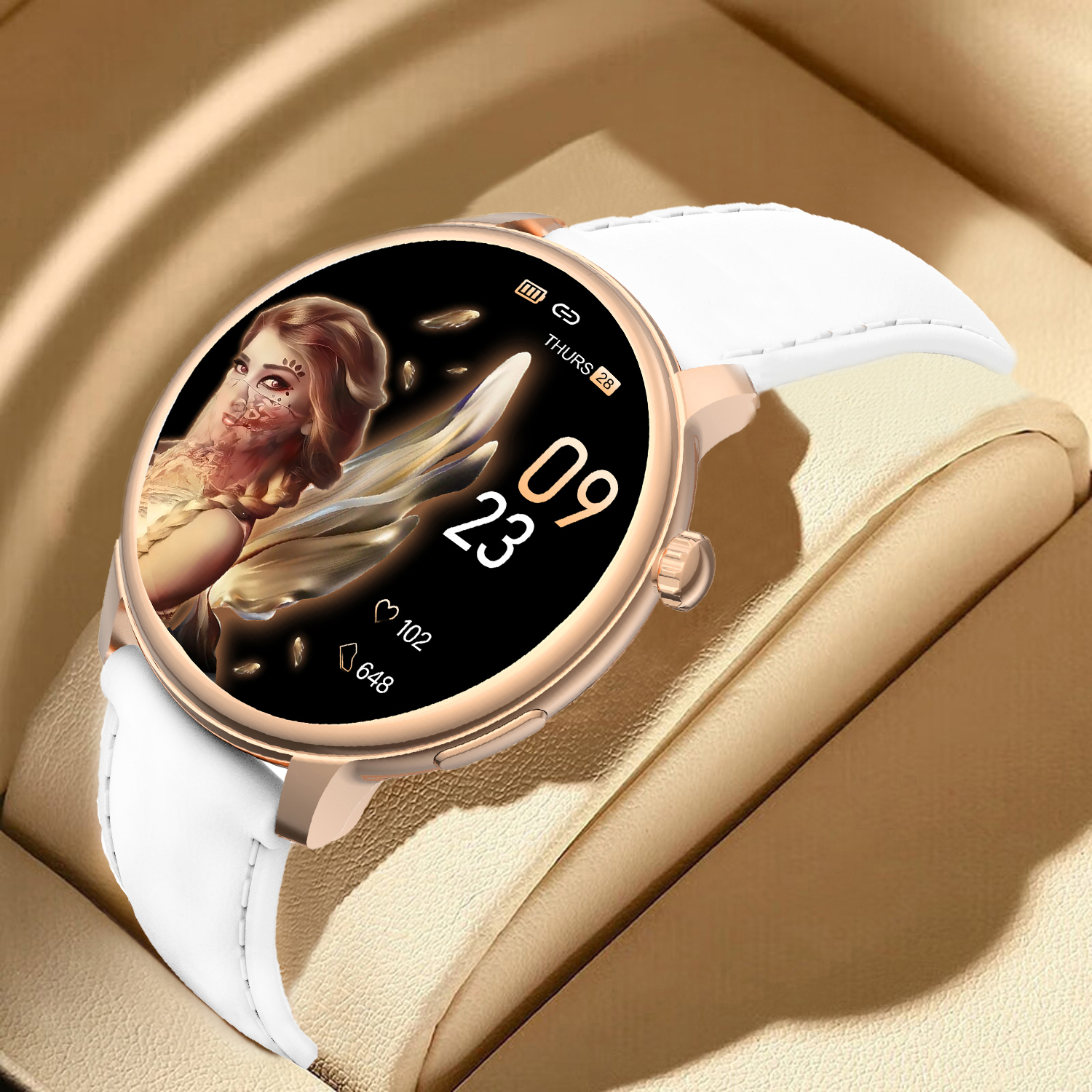A gold smartwatch with a white strap is displayed. The watch face shows a woman and the date. It's in a beige box.