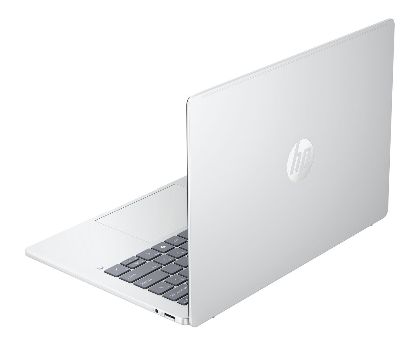 Un portátil HP blanco está abierto. El teclado es visible. La pantalla está ligeramente entreabierta, mostrando el logotipo de HP en la parte trasera.