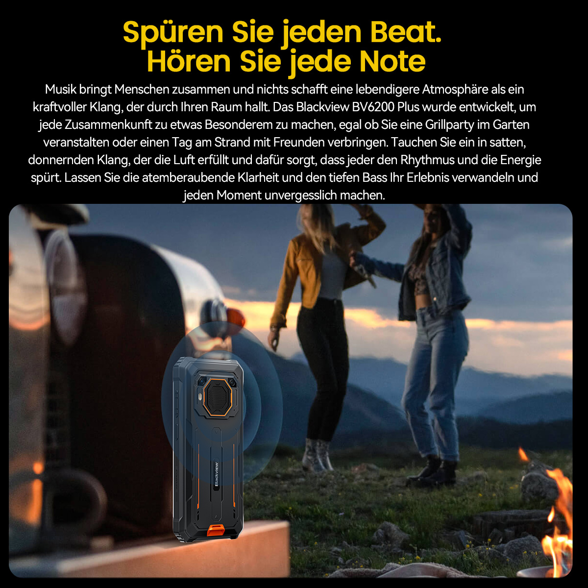 Zwei Frauen tanzen in der Nähe eines Feuers und eines Blackview BV6200 Plus-Lautsprechers, Abend-Szene im Freien.