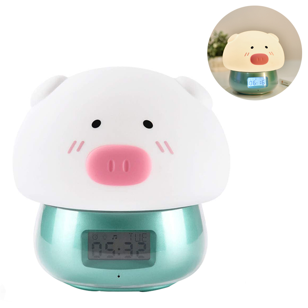 Ein schweineförmiger Wecker mit weißem Körper, rosa Schnauze und schwarzen Augen. Er zeigt die Uhrzeit an. Ein Einsatz zeigt eine ähnliche Uhr.