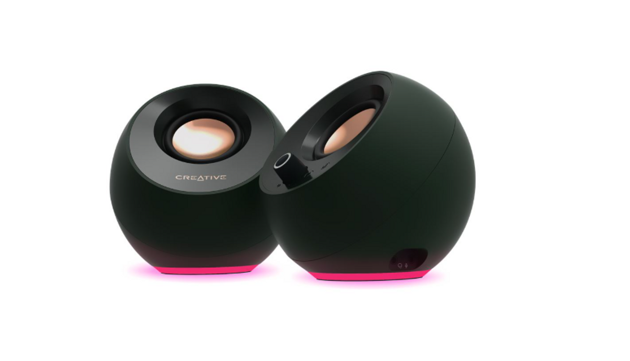 Zwei dunkelgrüne Lautsprecher mit pinkfarbenen Neonbasen, Creative-Logo sichtbar. Die Lautsprecher sind oval geformt, mit goldfarbenen Lautsprecherkegeln.