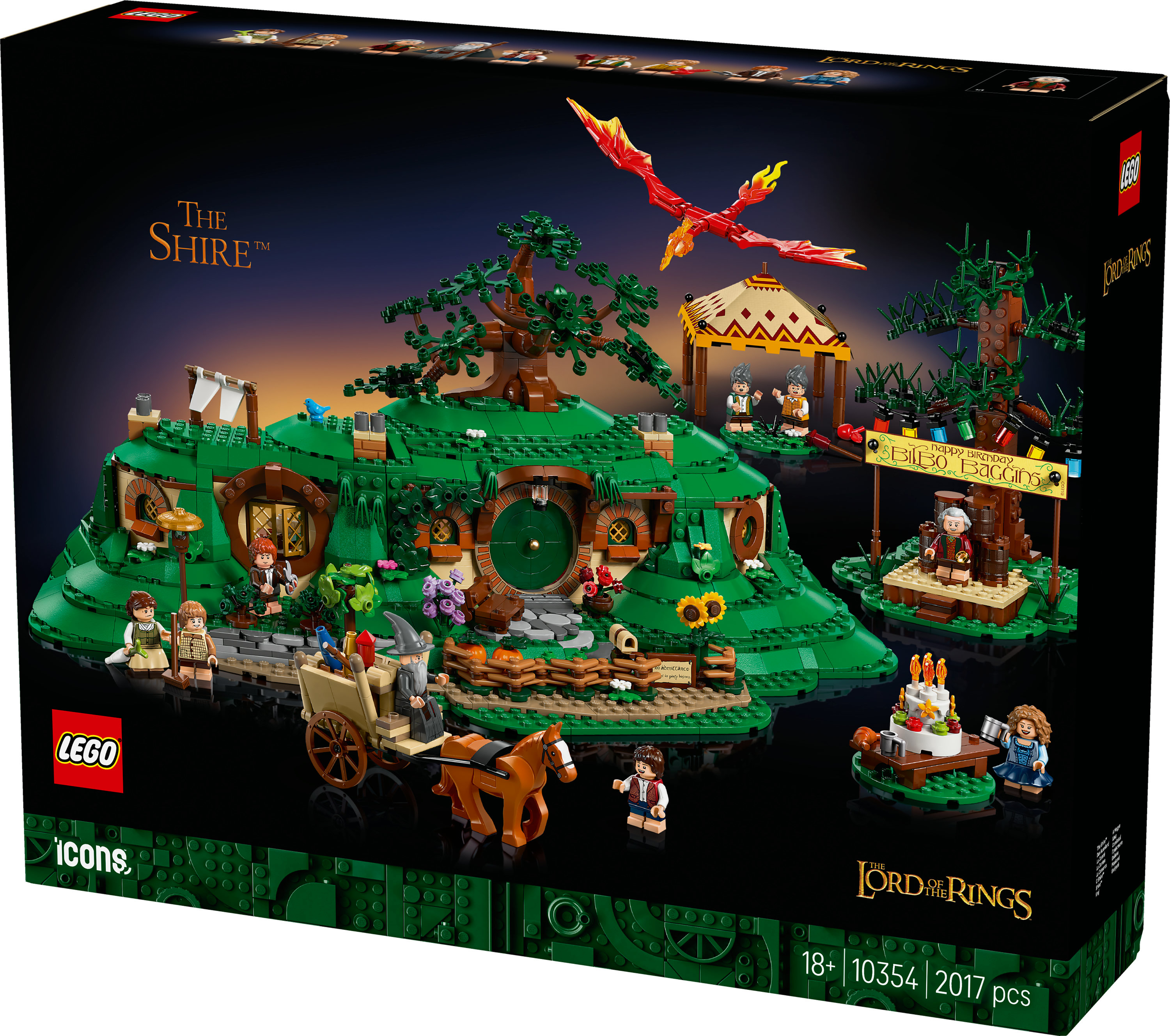 Pudełko zestawu Lego. Scena z Shire z figurkami, czerwonym smokiem i wozem ciągniętym przez konia.