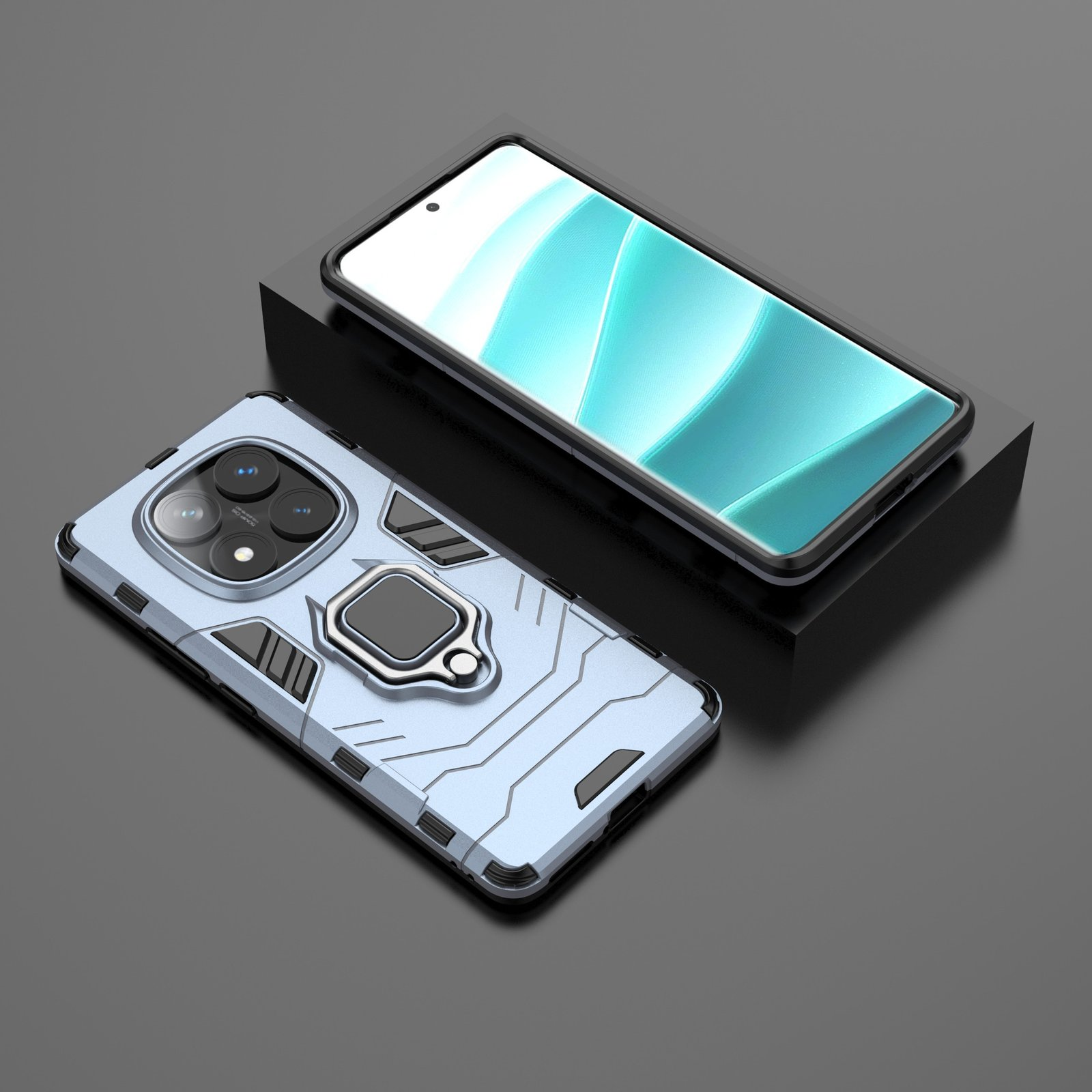 Dos smartphones, uno en una funda azul claro con soporte de anillo y otro sobre un soporte negro, pantalla.