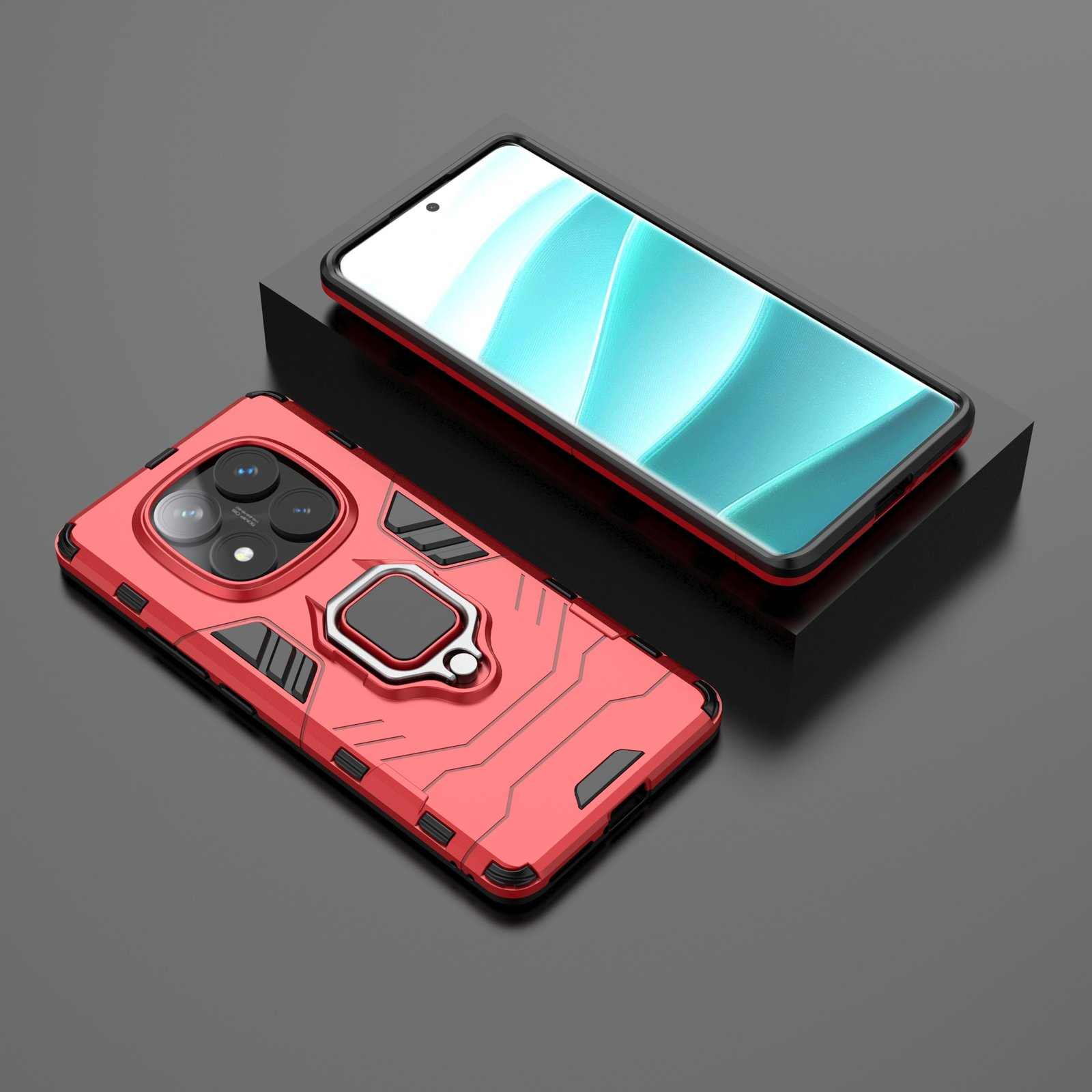 Funda roja con soporte de anillo y un teléfono sobre superficie negra. Otro teléfono sobre un bloque negro.