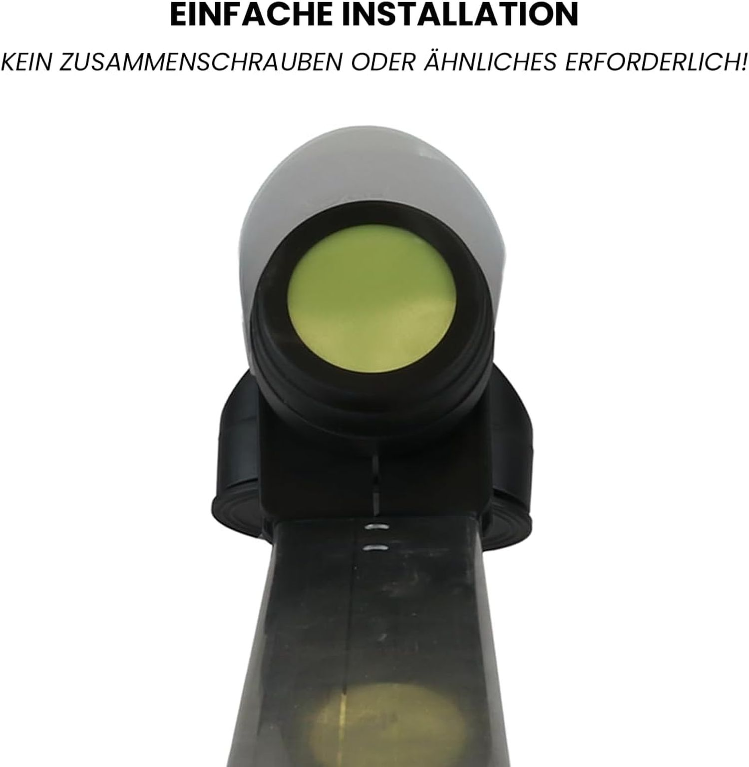 Nahaufnahme eines Geräts mit grauem Oberteil und grüner Linse. Das Gerät ist schwarz und zylindrisch. Text oben.