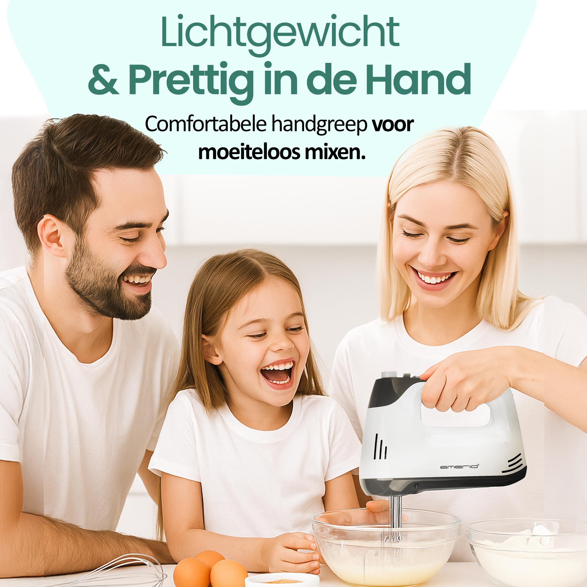 Family laughs while using a hand mixer. A woman uses the mixer. Eggs and flour are on the table.