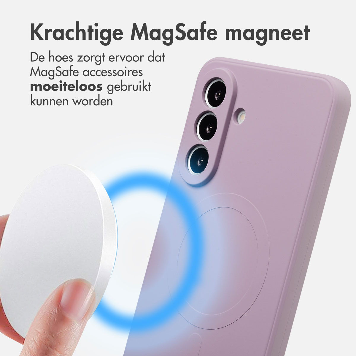 Een hand houdt een witte schijf vast bij een paarse telefoonhoes. Een blauw magnetisch veld wordt getoond. Nederlandse tekst.