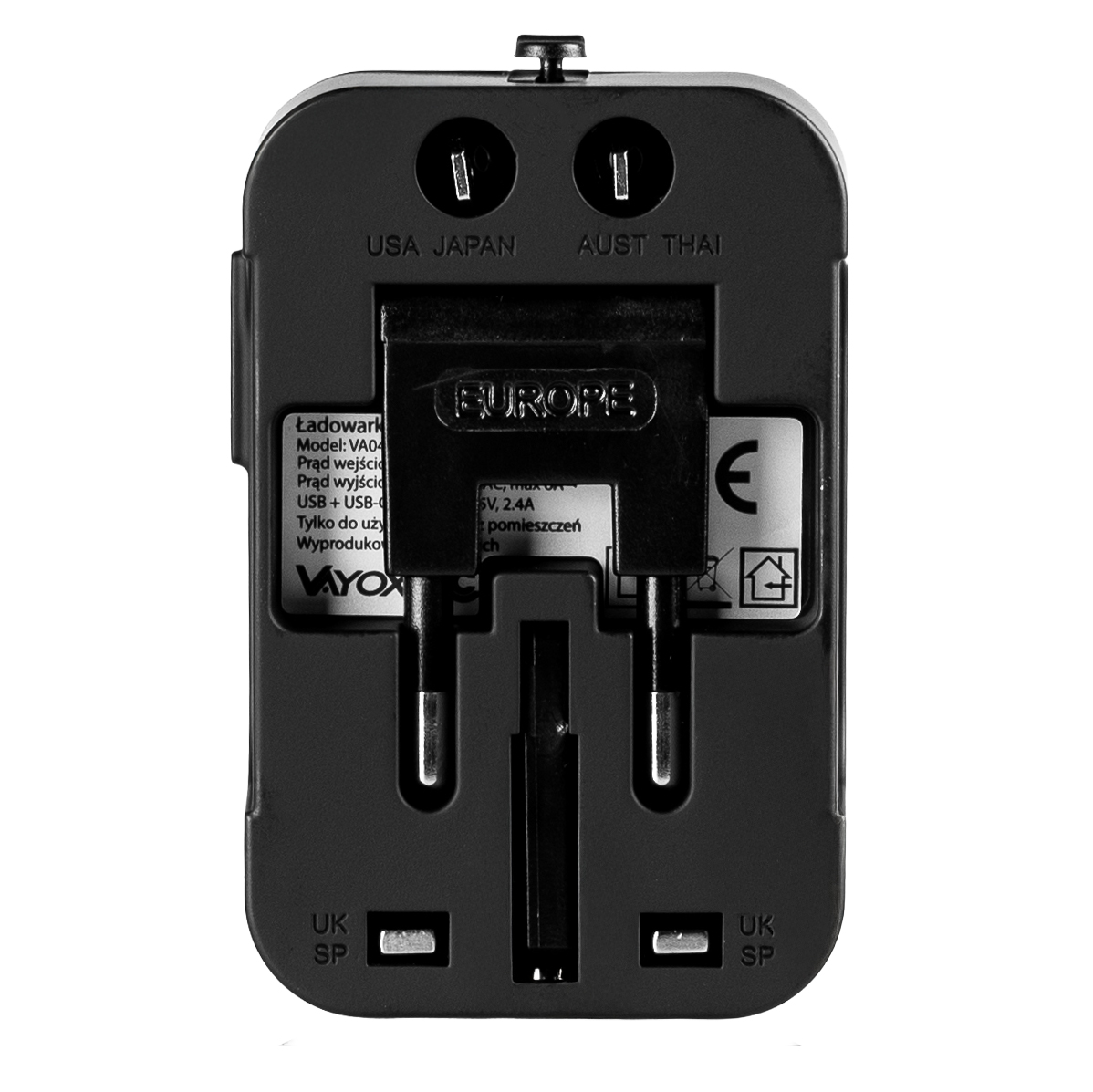 Czarny uniwersalny adapter podróżny z wieloma typami wtyczek i oznaczeniami "USA JAPAN", "AUST THAI" i "EUROPE".