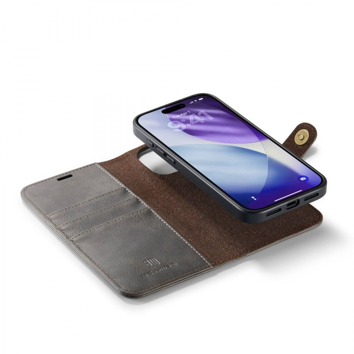 Ein iPhone liegt auf einer geöffneten Leder-Wallet-Hülle. Das Telefon zeigt einen Startbildschirm an. Die Hülle ist braun und grau mit Schnappverschluss.