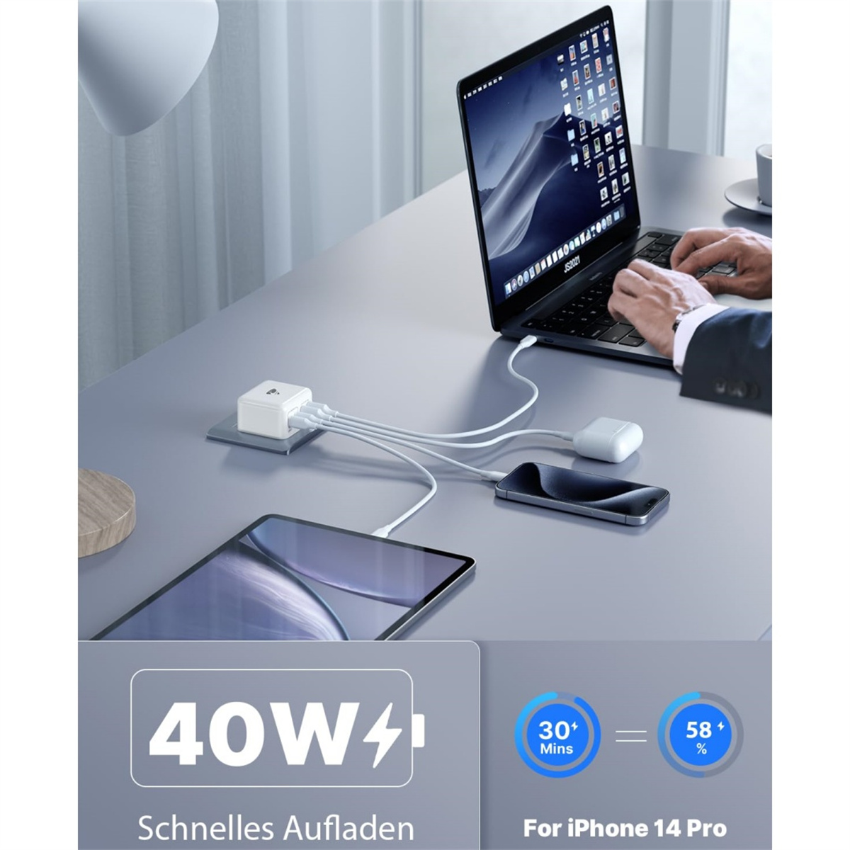 Laptop, Telefon, Tablet und Ohrhörer werden geladen. Ein 40-W-Ladegerät mit Ladezeit- und Prozentangaben wird angezeigt.
