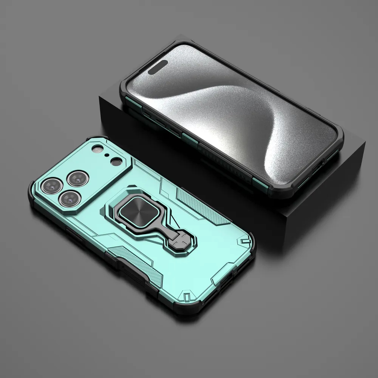 Twee telefoonhoesjes. Eén turquoise met een ringhouder, de andere zwart. Beide liggen op een donkergrijze ondergrond.