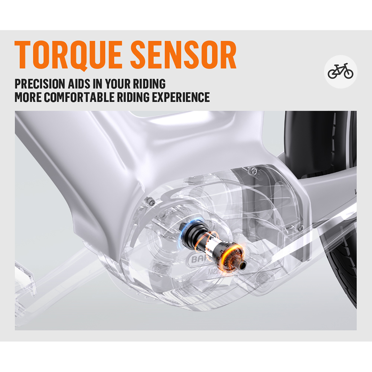 Zdjęcie przedstawia czujnik momentu obrotowego w rowerze, pomarańczowy tekst mówi 'Czujnik momentu obrotowego'. Przezroczysta obudowa pokazuje elementy wewnętrzne.