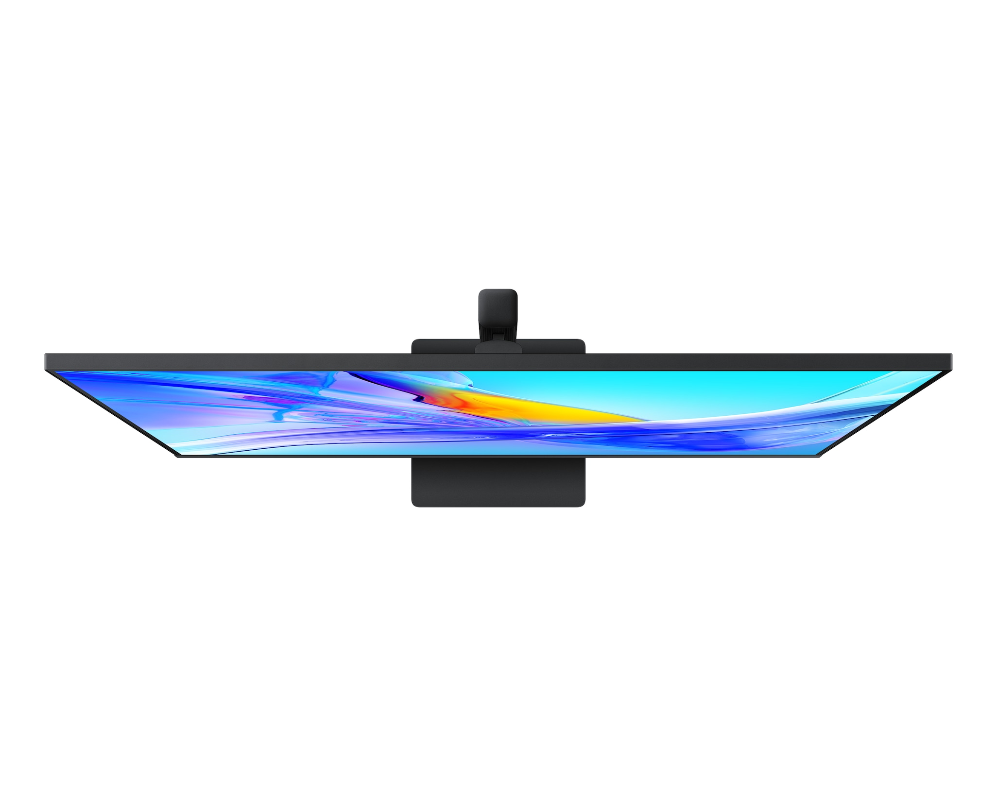 Widok z góry na czarny monitor komputerowy na białym tle, wyświetlający kolorowy abstrakcyjny obraz.