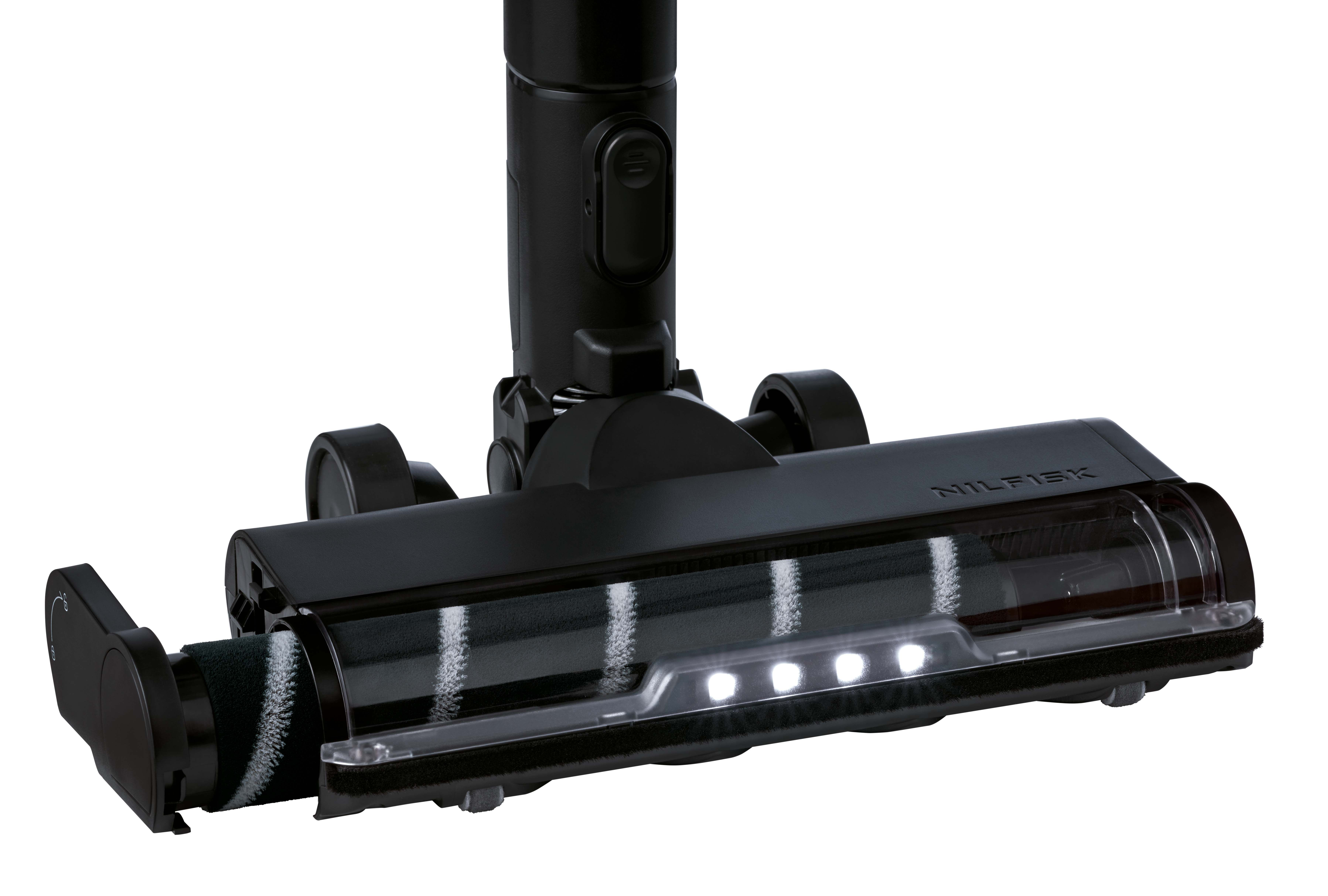 Tête d'aspirateur Nilfisk noire. Elle a une brosse rotative, des roues et des lumières LED. Le fond est blanc.