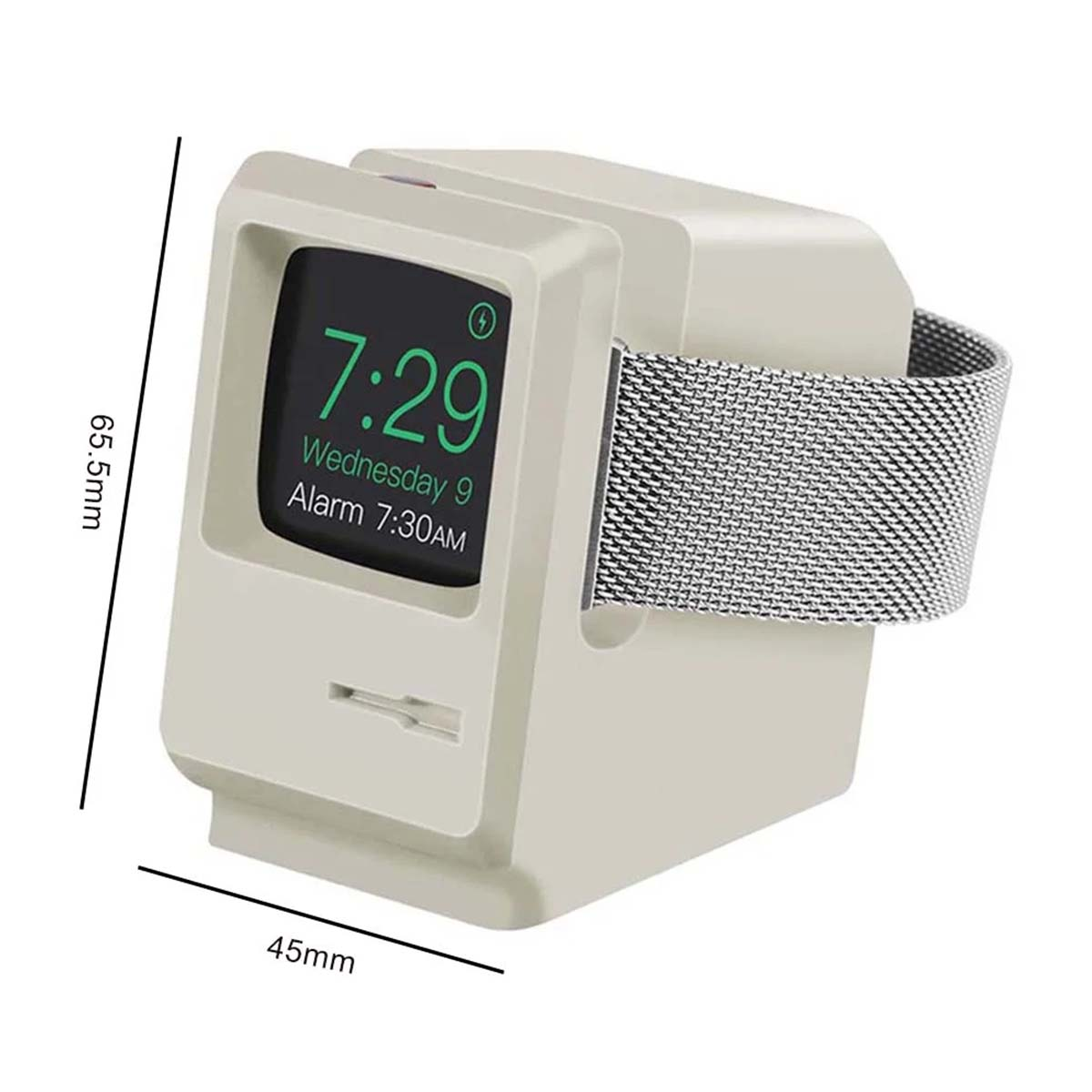 Un chargeur Apple Watch blanc dans le style d'un ancien Macintosh. La montre affiche 7:29, mercredi et Alarme 7:30 AM. Un bracelet argenté est attaché.