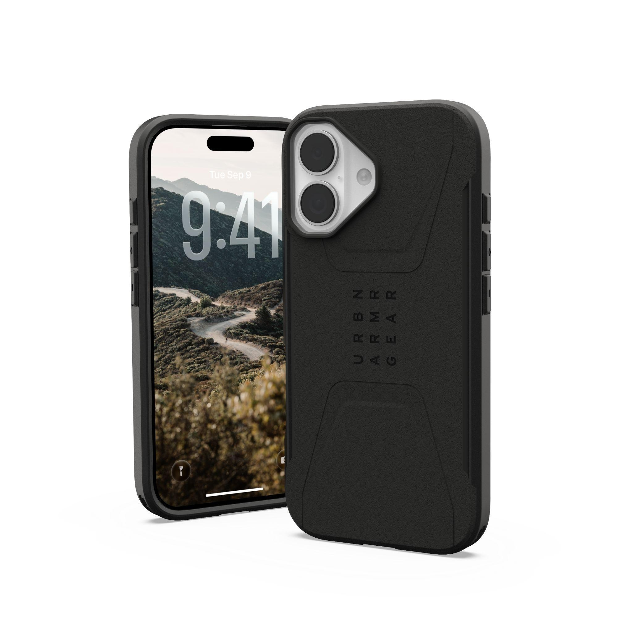 Smartphone avec étui noir. L'écran affiche un paysage de route de montagne. L'étui porte le logo 'URBAN ARMOR GEAR'.