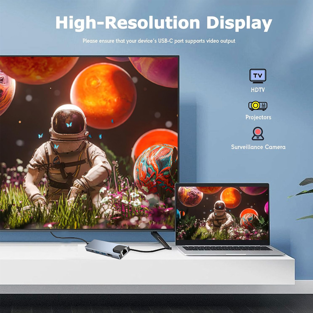 Ein Astronaut auf einem großen Bildschirm, verbunden mit einem Laptop und Hub. Symbole für TV, HDTV, Projektoren und Überwachungskamera.