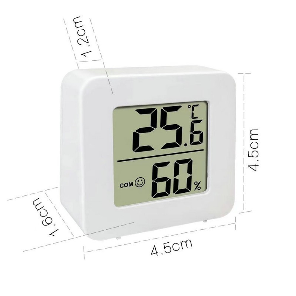 Ein weißes digitales Thermometer zeigt 25,6 °F und 60 % Luftfeuchtigkeit an. Es zeigt auch ein Smiley und das Wort COM.