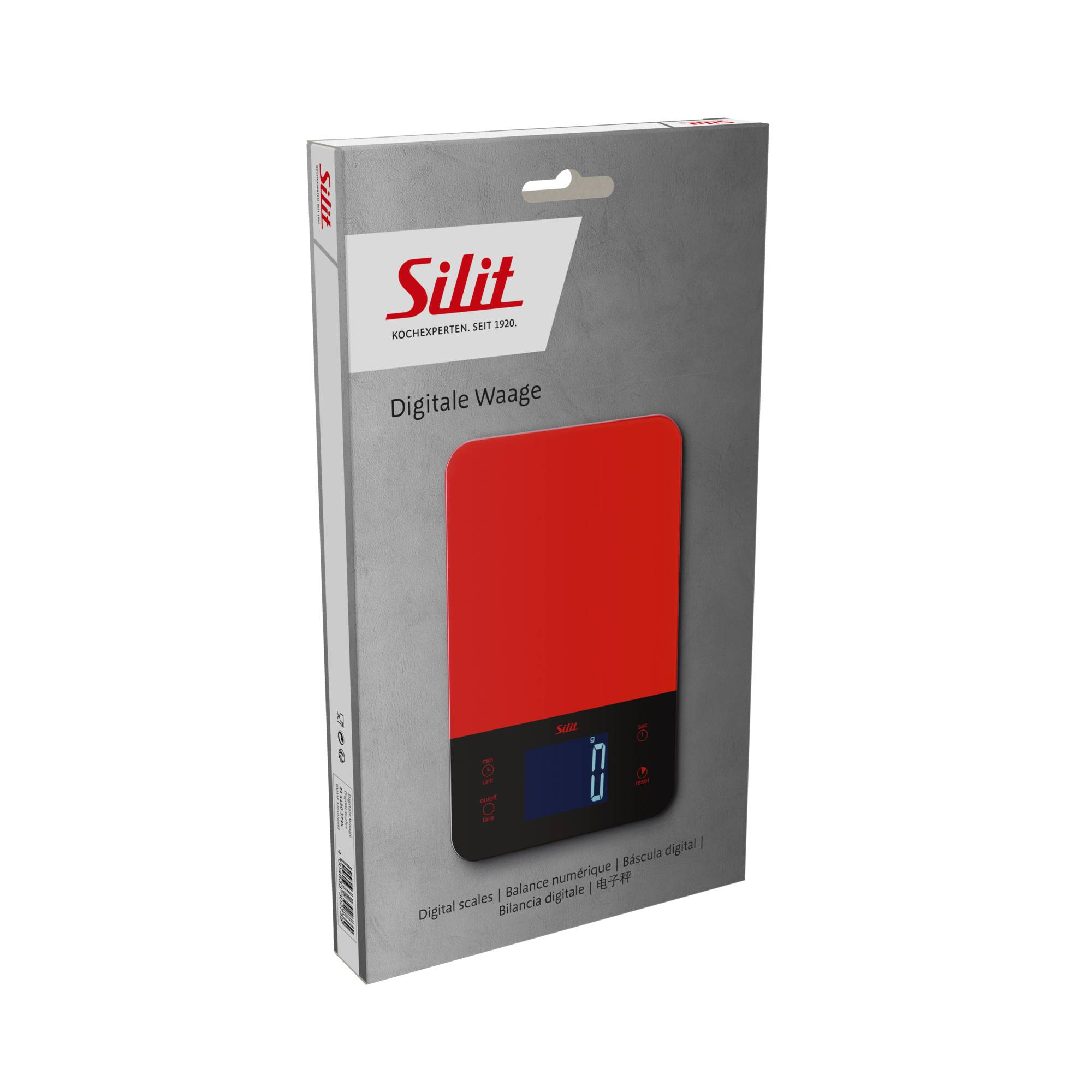 Eine rote digitale Küchenwaage in einer grauen Box, Markenname Sililit. Die Waage hat eine Digitalanzeige mit dem Gewicht in Gramm.