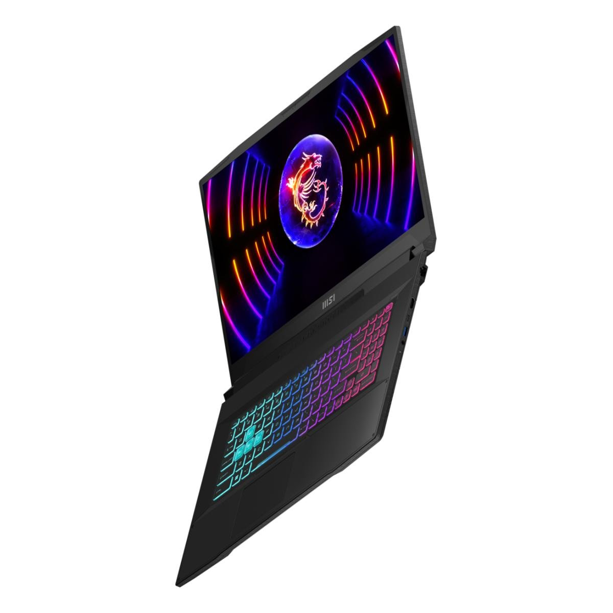 Czarny laptop MSI jest pochylony, wyświetlając kolorowy ekran z logo smoka i tęczową klawiaturą, na białym tle.