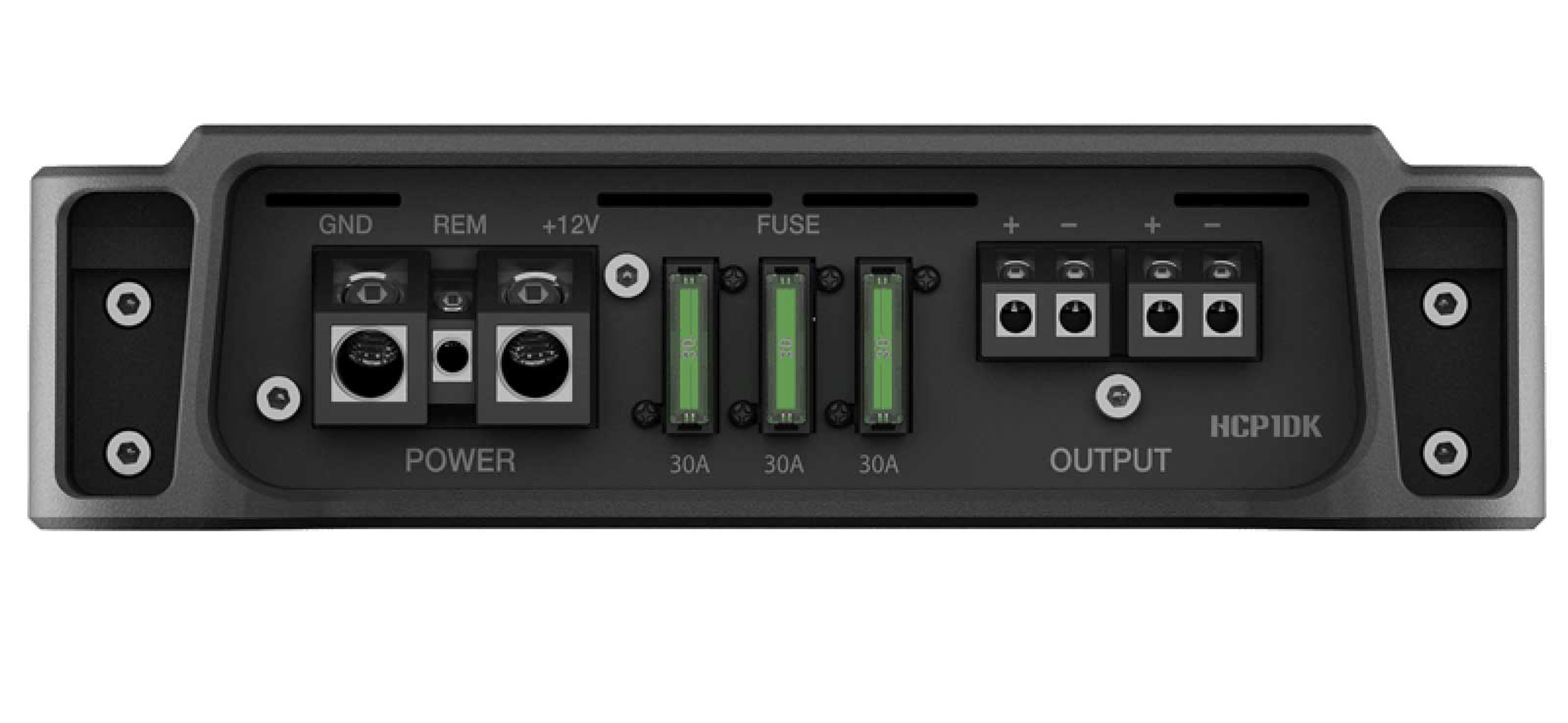 Ein schwarzer Verstärker mit verschiedenen Anschlussports: GND, REM, +12V, FUSE und OUTPUT. Grüne Sicherungen sind sichtbar.