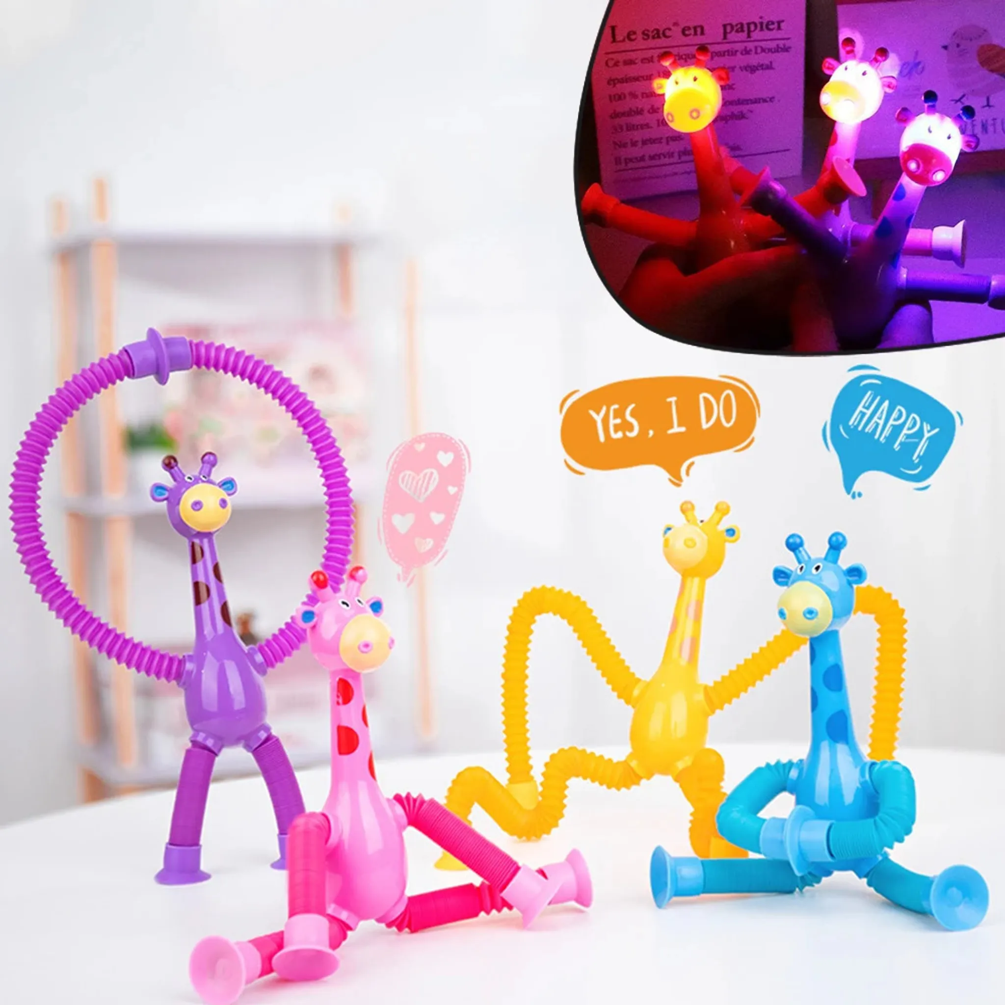 Das Bild zeigt Spielzeuggiraffen in Lila, Rosa, Gelb und Blau. Einige haben Sprechblasen und eine beleuchtete Version.