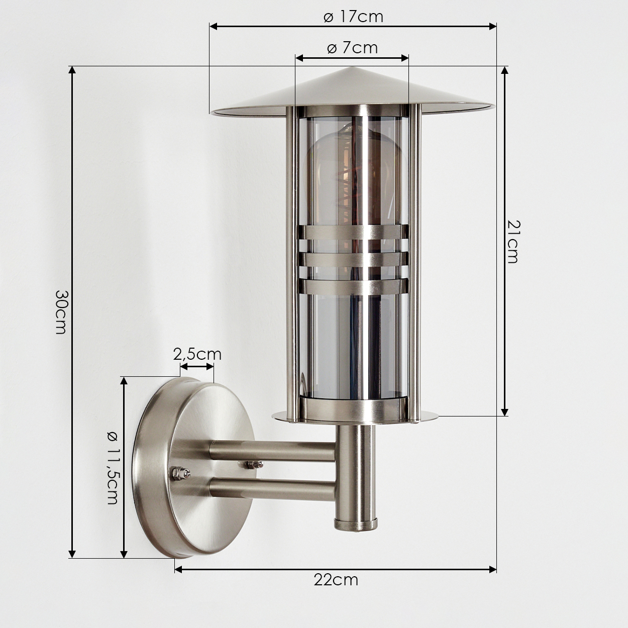 Eine Außenwandleuchte aus Edelstahl mit Maßangaben wird gezeigt. Die Lampe hat ein zylindrisches Glasgehäuse und eine kreisförmige Wandhalterung.